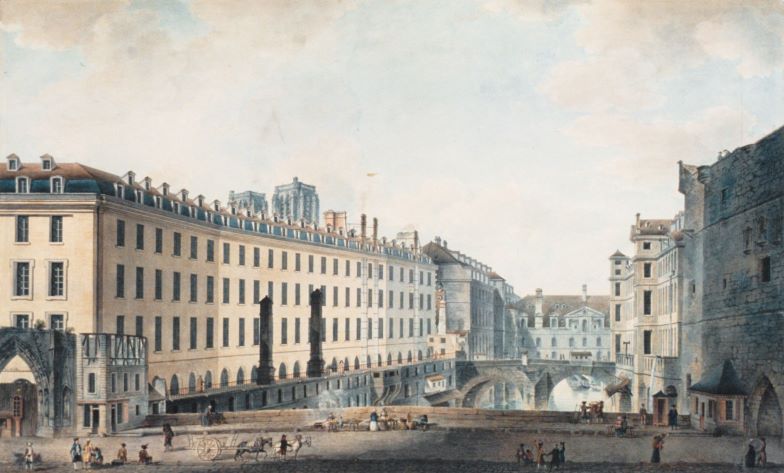Historic view of a European cityscape, featuring buildings lining a wide street with pedestrians, horse-drawn carriages, and a bridge in the background under a cloudy sky.
